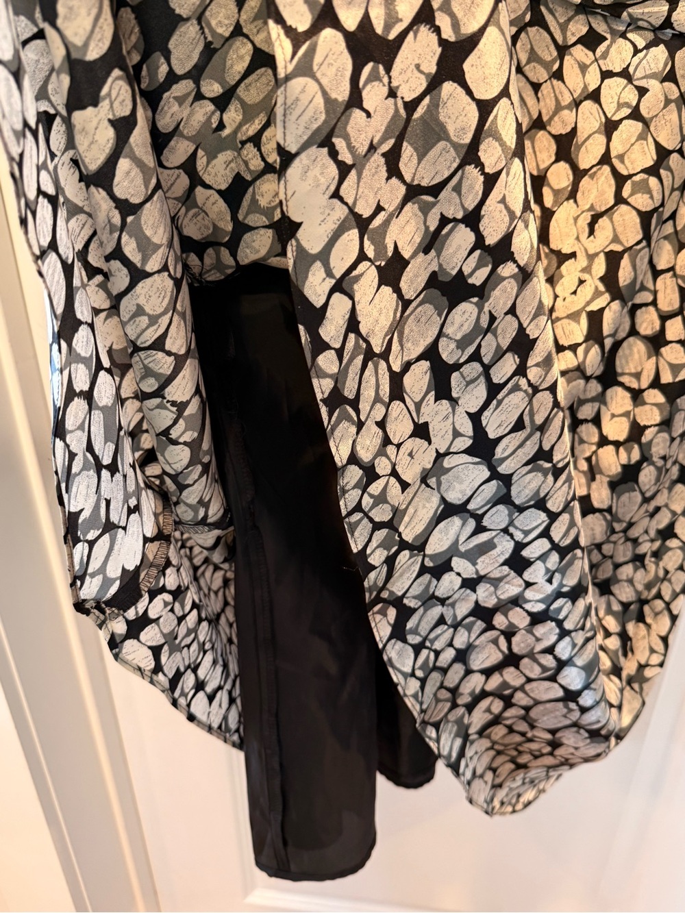 Black and ivory sleeveless fit-and-flare dress with an abstract pebble print. - Picture 3 of 5